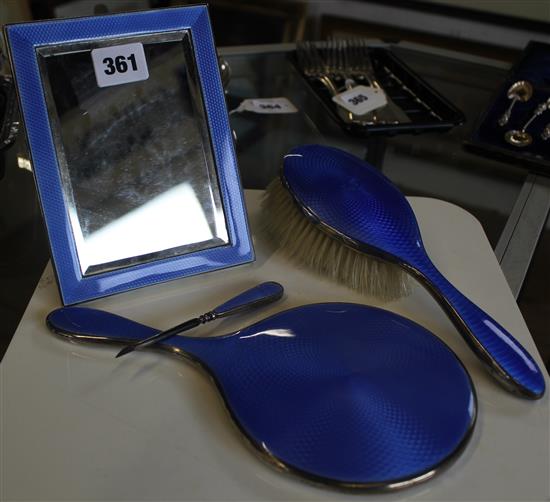 Silver and blue enamel easel mirror and a handbrush and a tool